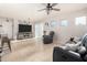 Open concept living room area with neutral walls, tile floors and plenty of natural light at 17970 N 114Th Ln, Surprise, AZ 85378