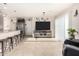 Bright living room offering tile flooring, modern furniture, and an open concept layout at 17970 N 114Th Ln, Surprise, AZ 85378