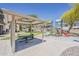 Community playground area with play structure, picnic tables, and grassy areas providing a Gathering-friendly environment at 17970 N 114Th Ln, Surprise, AZ 85378