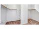 Walk-in closet features shelving and rod for optimal storage, with carpeted flooring at 17985 W Ivy Ln, Surprise, AZ 85388