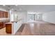 Open kitchen with granite countertops and stainless appliances overlooks the living area and features tile flooring at 17985 W Ivy Ln, Surprise, AZ 85388