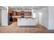 Modern kitchen with wooden cabinets, granite countertops, breakfast bar, and stainless steel appliances at 17985 W Ivy Ln, Surprise, AZ 85388