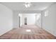 Bright, open living room featuring fresh white paint, neutral carpet, and a ceiling fan to stay cool at 17985 W Ivy Ln, Surprise, AZ 85388