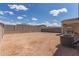Large backyard with block wall, covered patio, and gravel at 18492 E Donato Dr, Gold Canyon, AZ 85118