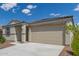 Single-story home with desert landscaping and a two-car garage is shown on a sunny day at 18492 E Donato Dr, Gold Canyon, AZ 85118