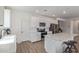 Bright kitchen features white cabinets, stainless steel appliances, and a center island with barstool seating at 18492 E Donato Dr, Gold Canyon, AZ 85118