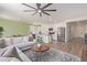 Open concept living room with white cabinets and stainless steel appliances visible from the living area at 18492 E Donato Dr, Gold Canyon, AZ 85118