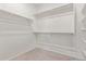 Spacious walk-in closet featuring ample shelving and rod space for organized storage at 18492 E Donato Dr, Gold Canyon, AZ 85118