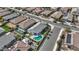 A high-angle view capturing a residential street with houses, some with pools and green spaces, in a suburban community at 19203 W Jackson St, Buckeye, AZ 85326