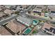 Aerial view of a neighborhood showcasing various homes, some featuring solar panels, pools, and well-maintained yards at 19203 W Jackson St, Buckeye, AZ 85326
