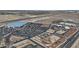 An aerial shot shows a sprawling commercial area with parking lots, roads, and various buildings at 19203 W Jackson St, Buckeye, AZ 85326