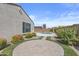 Paver patio surrounded by grass and desert landscaping leads to the pool at 19203 W Jackson St, Buckeye, AZ 85326
