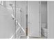 Bright bathroom with a glass walk-in shower, toilet, and open entry way to a closet with wood floors at 19203 W Jackson St, Buckeye, AZ 85326