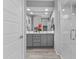 Bright bathroom featuring a double vanity, tile floors, walk-in glass shower and an open entry way at 19203 W Jackson St, Buckeye, AZ 85326