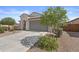 Charming single-story home with a well-manicured front yard and two car garage at 19203 W Jackson St, Buckeye, AZ 85326