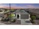 Charming single-Gathering home showcasing desert landscaping, tile roof, and neutral tones against a beautiful desert sunset at 19203 W Jackson St, Buckeye, AZ 85326