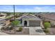 Charming single-story home with a tile roof and desert landscaping, offering curb appeal in a suburban setting at 19203 W Jackson St, Buckeye, AZ 85326