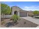 Charming single-story home with a well-manicured front yard and two car garage at 19203 W Jackson St, Buckeye, AZ 85326