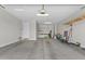 Spacious garage offers ample storage space with shelving and a side door at 19203 W Jackson St, Buckeye, AZ 85326