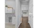 Hallway view to laundry room, kitchen, and other areas of the house at 19203 W Jackson St, Buckeye, AZ 85326