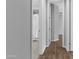 Hallway view of bathroom with white shower curtain at 19203 W Jackson St, Buckeye, AZ 85326
