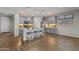 Contemporary kitchen with an island, bar stools, pendant lights, and stainless steel appliances at 19203 W Jackson St, Buckeye, AZ 85326