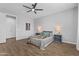 Stylish primary bedroom featuring ample natural light, wood floors, and ceiling fan at 19203 W Jackson St, Buckeye, AZ 85326