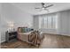 Stylish primary bedroom featuring ample natural light, wood floors, and ceiling fan at 19203 W Jackson St, Buckeye, AZ 85326