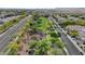 Picturesque aerial view of a neighborhood with tree-lined streets and lush green spaces, perfect for community living at 19203 W Jackson St, Buckeye, AZ 85326