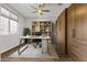 Bright and airy office featuring custom wood built-ins, a ceiling fan, and a comfortable work space at 19203 W Jackson St, Buckeye, AZ 85326