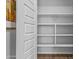 View of a pantry with white shelves and lighting at 19203 W Jackson St, Buckeye, AZ 85326