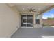 Covered patio features ceiling fan and sliding glass door leading to the backyard at 19203 W Jackson St, Buckeye, AZ 85326