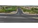 A wide street view with community signage and green spaces, suggesting a well-maintained and welcoming neighborhood at 19203 W Jackson St, Buckeye, AZ 85326
