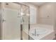 Bright bathroom with a separate shower and soaking tub for a relaxing experience at 2042 W Mark Ln, Phoenix, AZ 85085