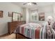 Bedroom boasting natural light, complemented by stylish furnishings and decor at 2042 W Mark Ln, Phoenix, AZ 85085