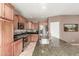 Stylish kitchen with granite island, stainless steel appliances, and custom cabinets at 2042 W Mark Ln, Phoenix, AZ 85085