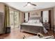 Spacious main bedroom with a ceiling fan and sliding glass doors to the outdoor patio at 2042 W Mark Ln, Phoenix, AZ 85085