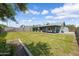 Spacious backyard with green lawn, landscaped flower beds, and a covered patio for outdoor entertaining at 20822 N 34Th Dr, Phoenix, AZ 85027