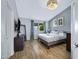 Bedroom features soft decor, wood-look floors, and natural light at 20822 N 34Th Dr, Phoenix, AZ 85027