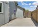 Side yard showing exterior paint color, block wall, and narrow side yard layout at 20822 N 34Th Dr, Phoenix, AZ 85027