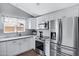 Modern kitchen with updated stainless steel appliances and ample counter space at 20822 N 34Th Dr, Phoenix, AZ 85027