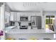 Well-equipped kitchen with stainless steel appliances, white cabinets, and a sleek countertop at 20822 N 34Th Dr, Phoenix, AZ 85027