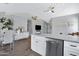 Bright kitchen features stainless steel appliances, white cabinetry and granite countertops at 20822 N 34Th Dr, Phoenix, AZ 85027