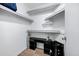 A walk-in closet featuring custom shelving, storage space, and a modern aesthetic at 20822 N 34Th Dr, Phoenix, AZ 85027
