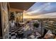 Balcony with views of the city and surrounding mountains, outdoor seating, and tiled flooring at 2211 E Camelback Rd # 902, Phoenix, AZ 85016