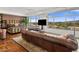 Bright, spacious bedroom with large windows, a comfortable leather sofa and scenic views at 2211 E Camelback Rd # 902, Phoenix, AZ 85016