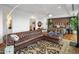 Spacious open floor plan with a bedroom and leather sofa, complemented by large windows at 2211 E Camelback Rd # 902, Phoenix, AZ 85016