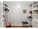 White open closet with hanging storage and shelving units at 2211 E Camelback Rd # 902, Phoenix, AZ 85016