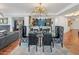 Bright dining area with bar area and bedroom in the distance at 2211 E Camelback Rd # 902, Phoenix, AZ 85016