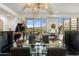 Dining room features a glass table, piano and beautiful views at 2211 E Camelback Rd # 902, Phoenix, AZ 85016